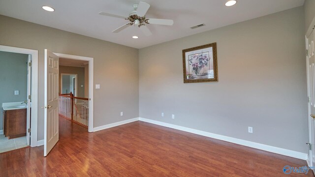 unfurnished bedroom with hardwood / wood-style flooring and ceiling fan