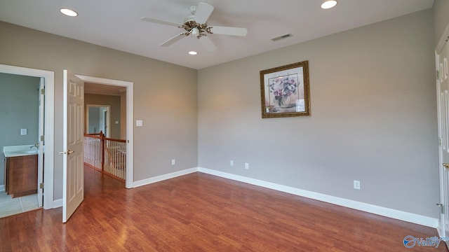 unfurnished bedroom with recessed lighting, wood finished floors, visible vents, baseboards, and ceiling fan