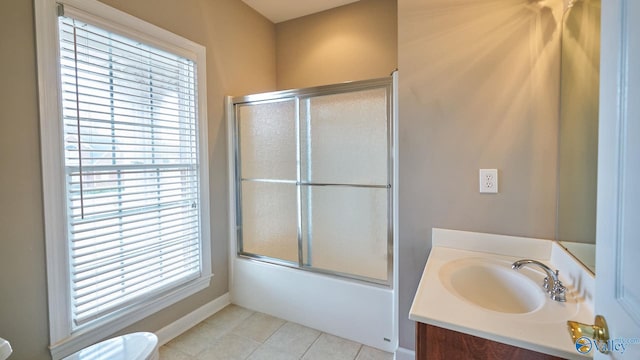full bath with toilet, tile patterned floors, combined bath / shower with glass door, vanity, and baseboards