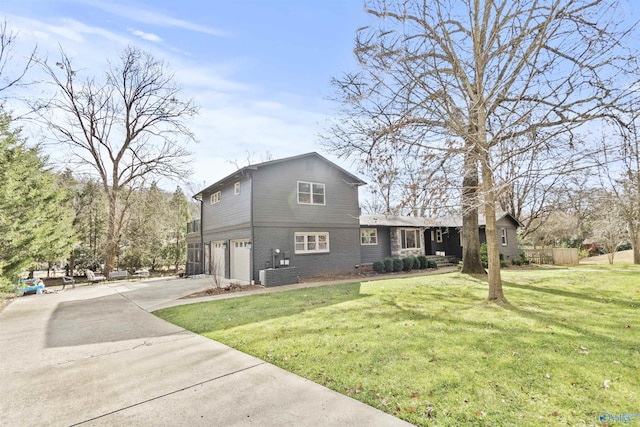 view of home's exterior with a lawn, cooling unit, and a garage