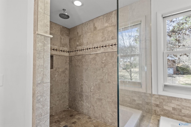 bathroom featuring tiled shower