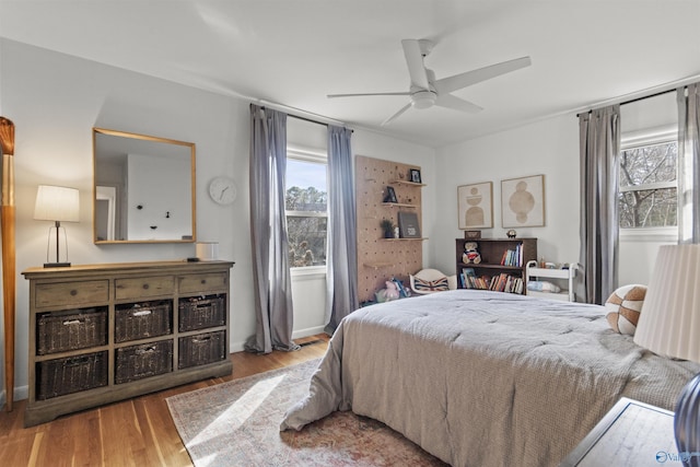 bedroom featuring wood-type flooring and ceiling fan