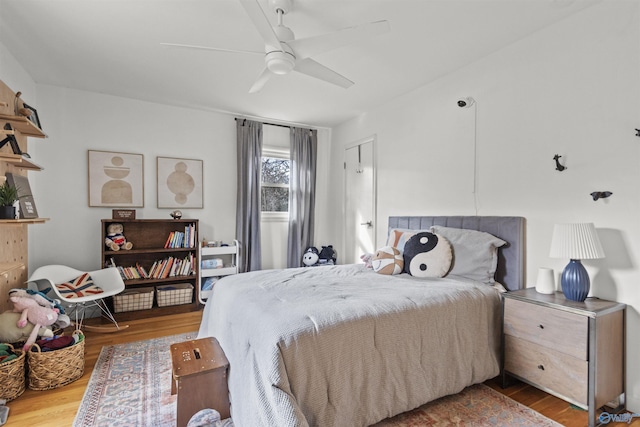 bedroom featuring ceiling fan and light hardwood / wood-style flooring