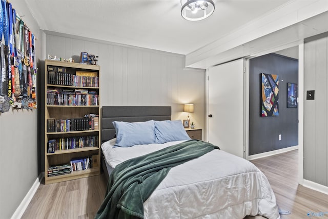 bedroom with hardwood / wood-style floors