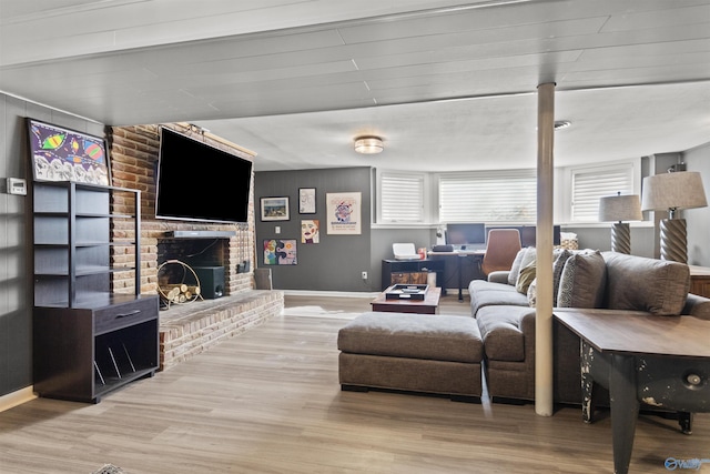 living room with a fireplace and light hardwood / wood-style flooring