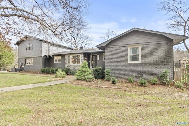 split level home with a front yard