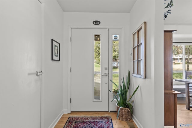 doorway with light hardwood / wood-style floors