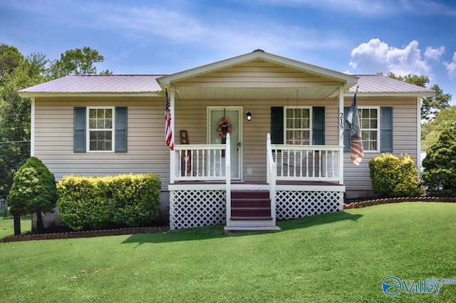 215 Dusty Dr SW, Arab, AL 35016 - bungalow-style house with a metal roof, a front yard, and a porch