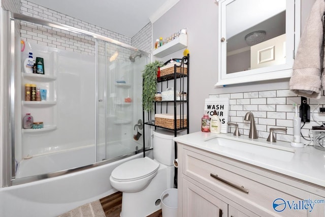 215 Dusty Dr SW, Arab, AL 35016 - full bathroom with backsplash, vanity, shower / bath combination with glass door, wood finished floors, and ornamental molding