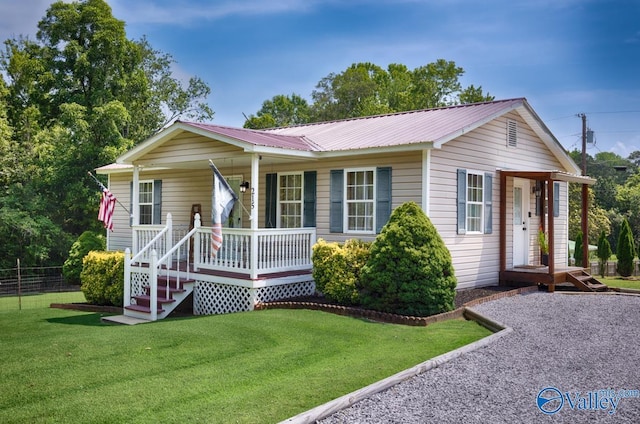 215 Dusty Dr SW, Arab, AL 35016 - single story home with covered porch and a metal roof