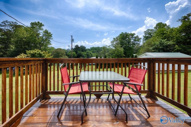 215 Dusty Dr SW, Arab, AL 35016 - wooden terrace with outdoor dining space and view of scattered trees