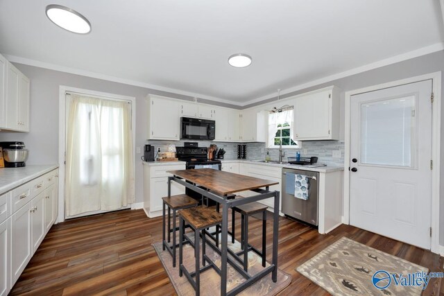 215 Dusty Dr SW, Arab, AL 35016 - kitchen with black appliances, light countertops, tasteful backsplash, white cabinetry, and crown molding