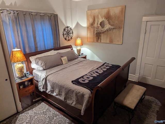 bedroom featuring dark hardwood / wood-style flooring