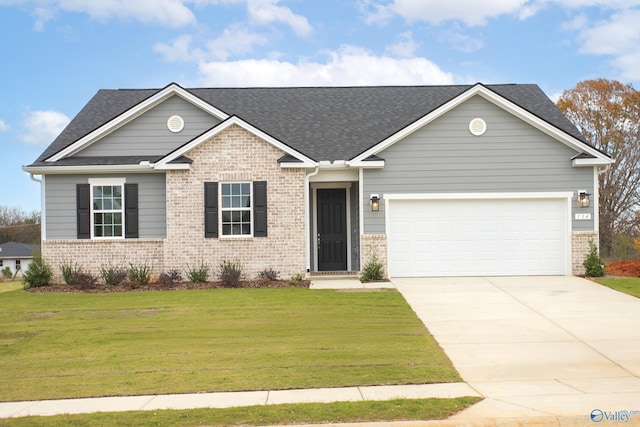 view of front of property featuring a garage and a front lawn