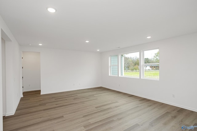 spare room featuring light hardwood / wood-style floors