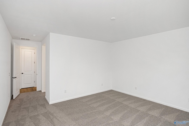 empty room featuring light colored carpet