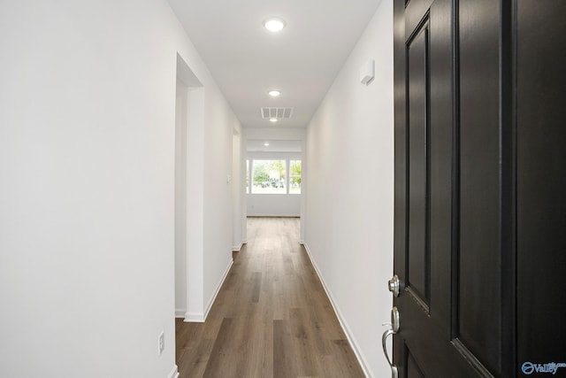 corridor featuring wood-type flooring