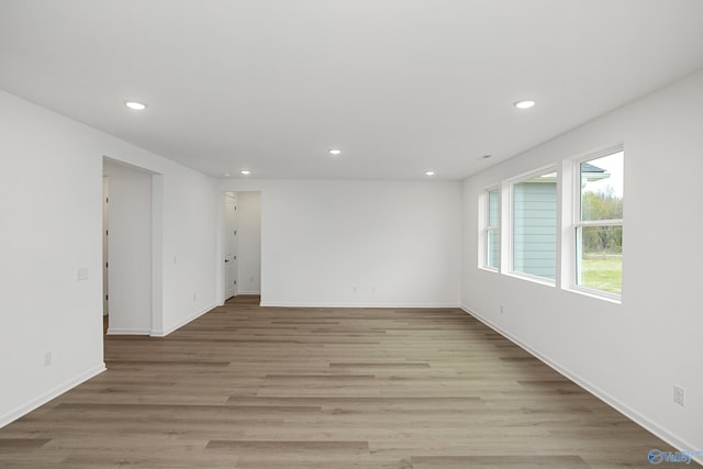 spare room with light hardwood / wood-style flooring