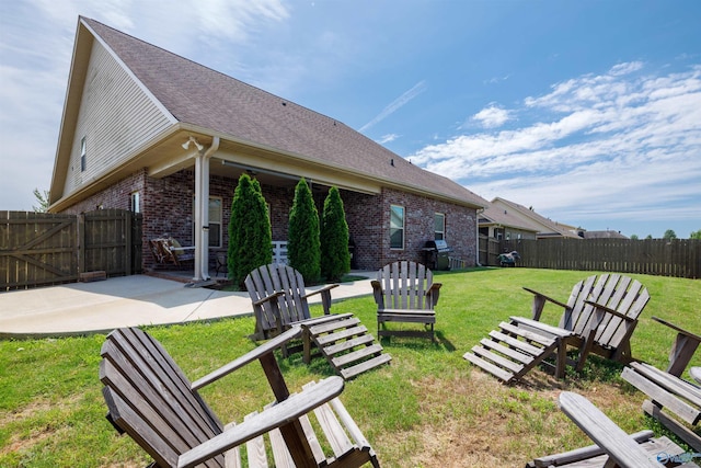 view of yard with a fenced backyard and a patio