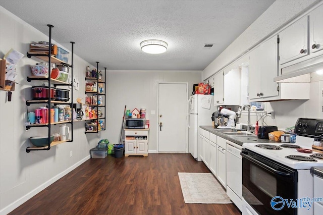 kitchen featuring sink, dark hardwood / wood-style flooring, a textured ceiling, white appliances, and white cabinets