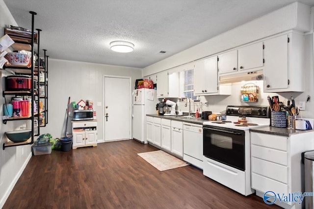 kitchen featuring a textured ceiling, white appliances, dark wood-type flooring, sink, and white cabinets