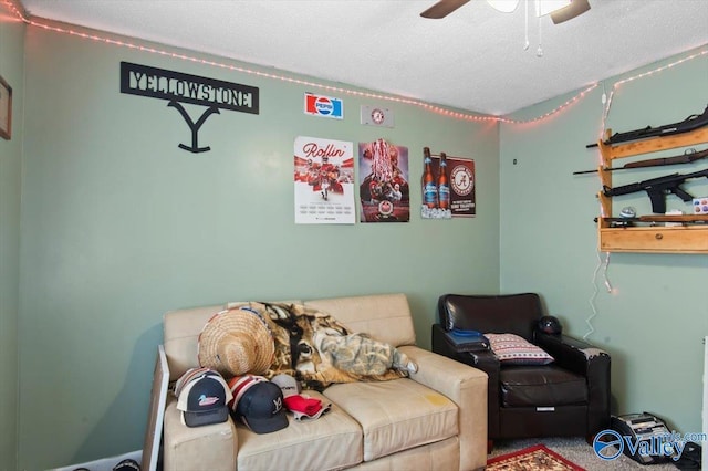 carpeted living room featuring a textured ceiling and ceiling fan