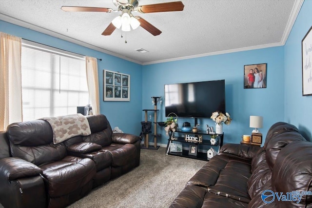 living room featuring carpet, ceiling fan, ornamental molding, and a textured ceiling