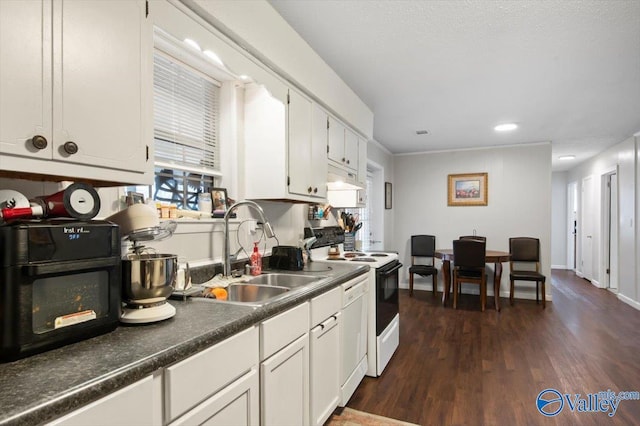 kitchen featuring white cabinets, dark hardwood / wood-style flooring, white appliances, and sink