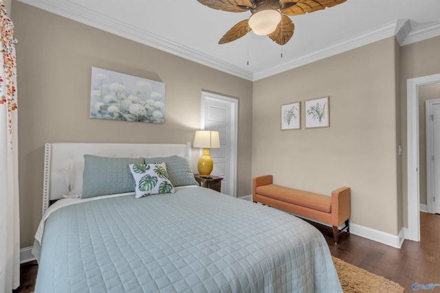 bedroom with dark hardwood / wood-style flooring, ceiling fan, and crown molding