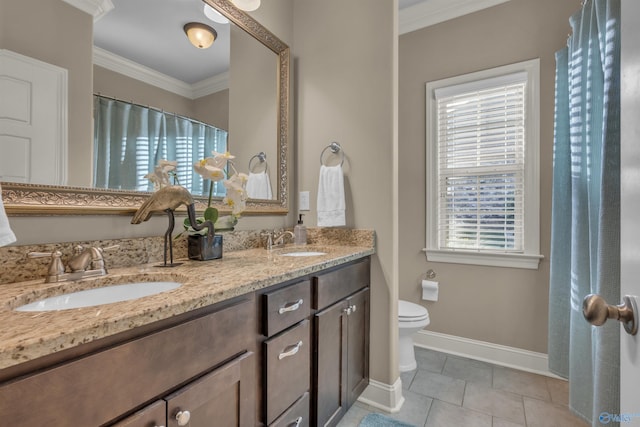 bathroom featuring ornamental molding, toilet, vanity, and tile patterned floors