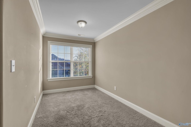 carpeted spare room featuring ornamental molding