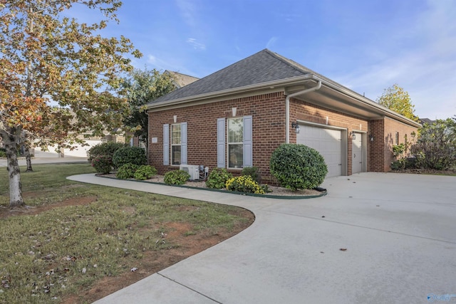 view of home's exterior featuring a garage, a yard, and ac unit