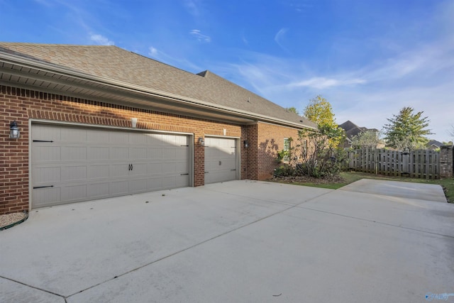 view of property exterior with a garage