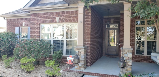 doorway to property with a porch