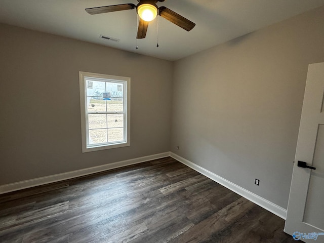 unfurnished room with ceiling fan and dark hardwood / wood-style flooring