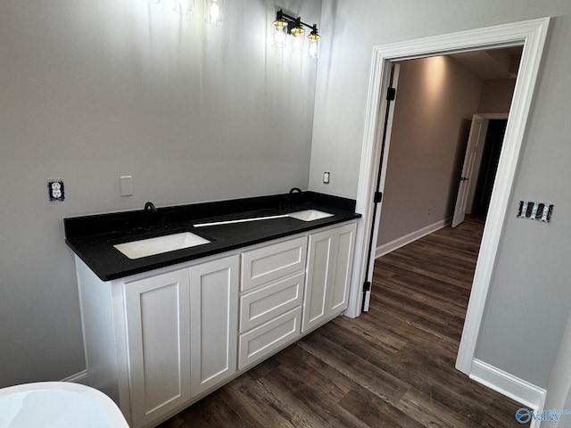 bathroom featuring vanity and hardwood / wood-style floors