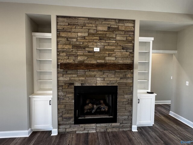 interior details with a fireplace, hardwood / wood-style floors, and built in features