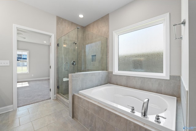 bathroom featuring shower with separate bathtub and tile patterned floors