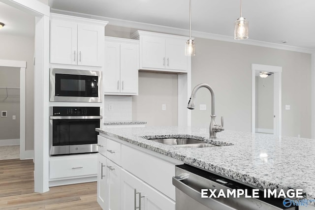 kitchen with white cabinetry, light hardwood / wood-style floors, stainless steel appliances, and sink