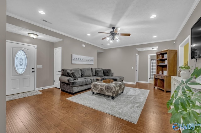 living area with a ceiling fan, visible vents, recessed lighting, wood finished floors, and baseboards