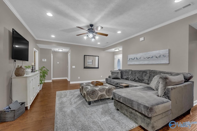 living area with visible vents, baseboards, ceiling fan, recessed lighting, and wood finished floors