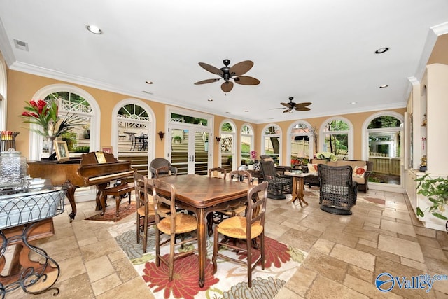 dining room featuring ornamental molding, ceiling fan, a healthy amount of sunlight, and french doors