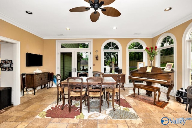 dining room featuring ceiling fan, plenty of natural light, french doors, and crown molding