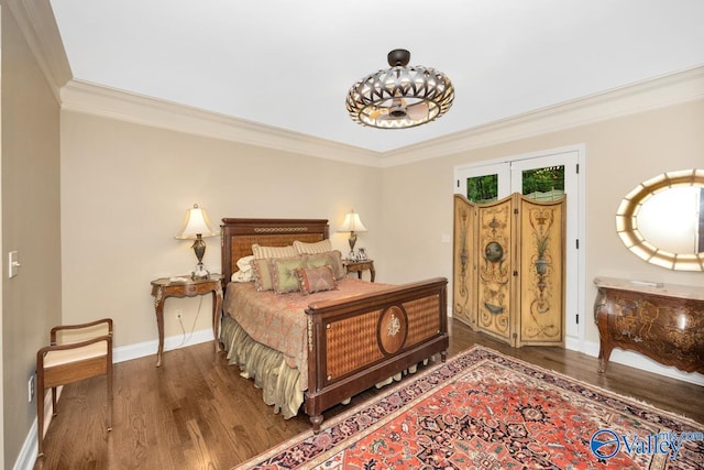 bedroom with crown molding and wood-type flooring