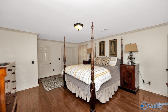 bedroom featuring ornamental molding and dark hardwood / wood-style floors