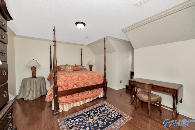 bedroom with a textured ceiling, lofted ceiling, and dark wood-type flooring