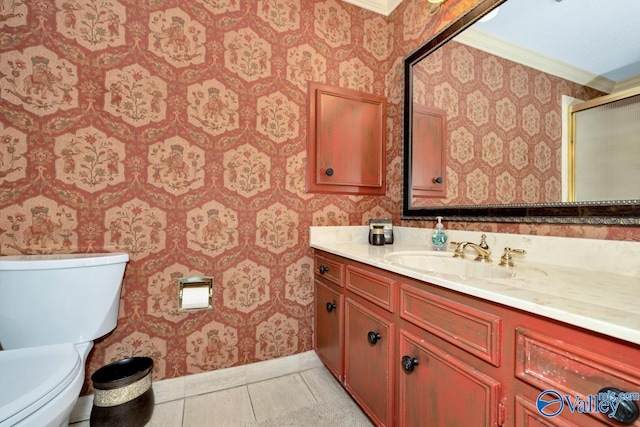 bathroom featuring vanity, crown molding, an enclosed shower, toilet, and tile patterned floors