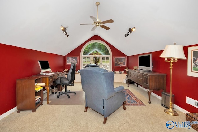 carpeted office space with lofted ceiling and ceiling fan