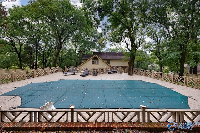 view of swimming pool with a patio area