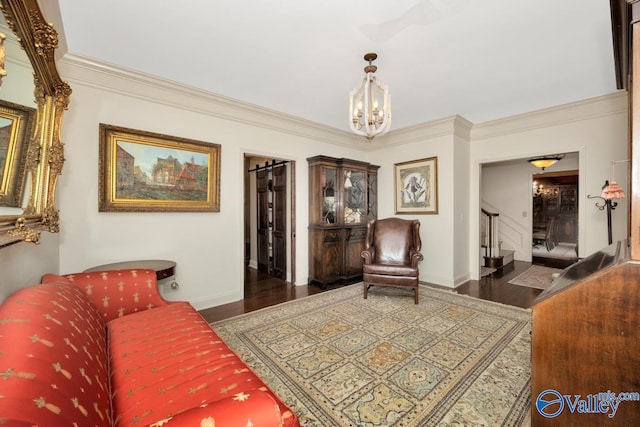 living room with a notable chandelier, crown molding, and dark wood-type flooring